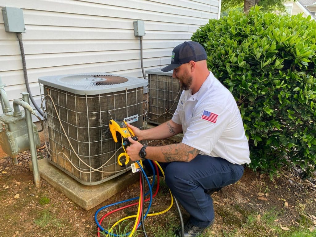 air conditioning technician performing a tune up