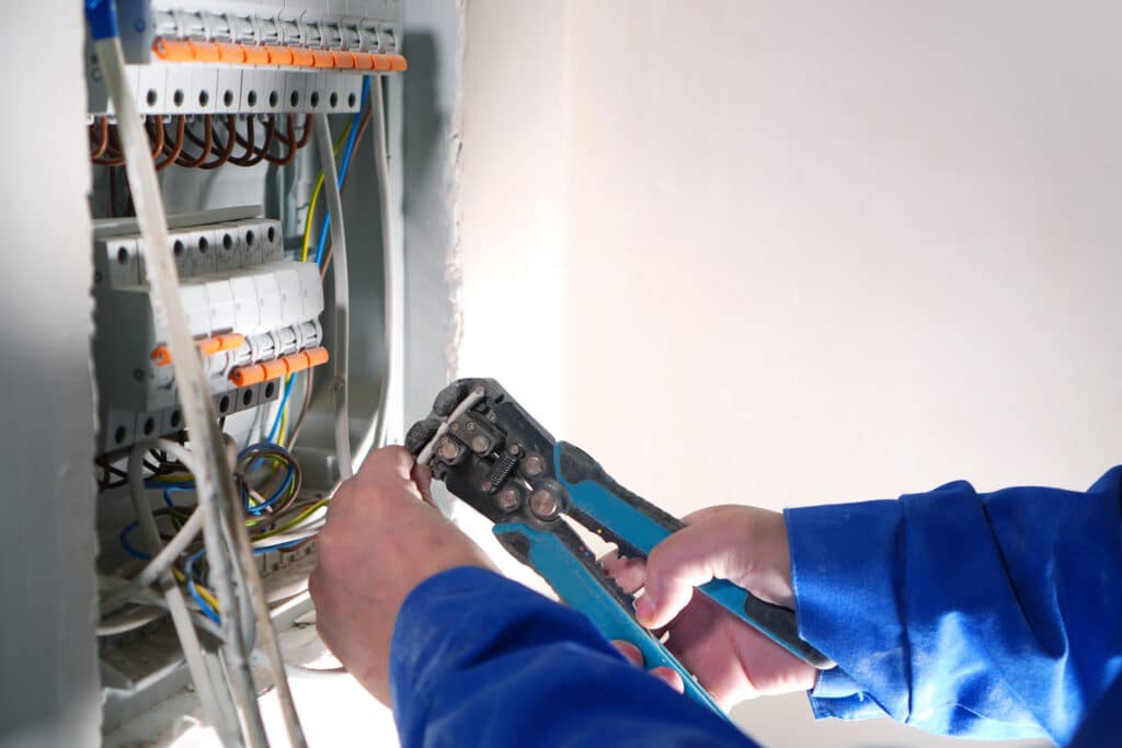 Electrician working on an electrical panel