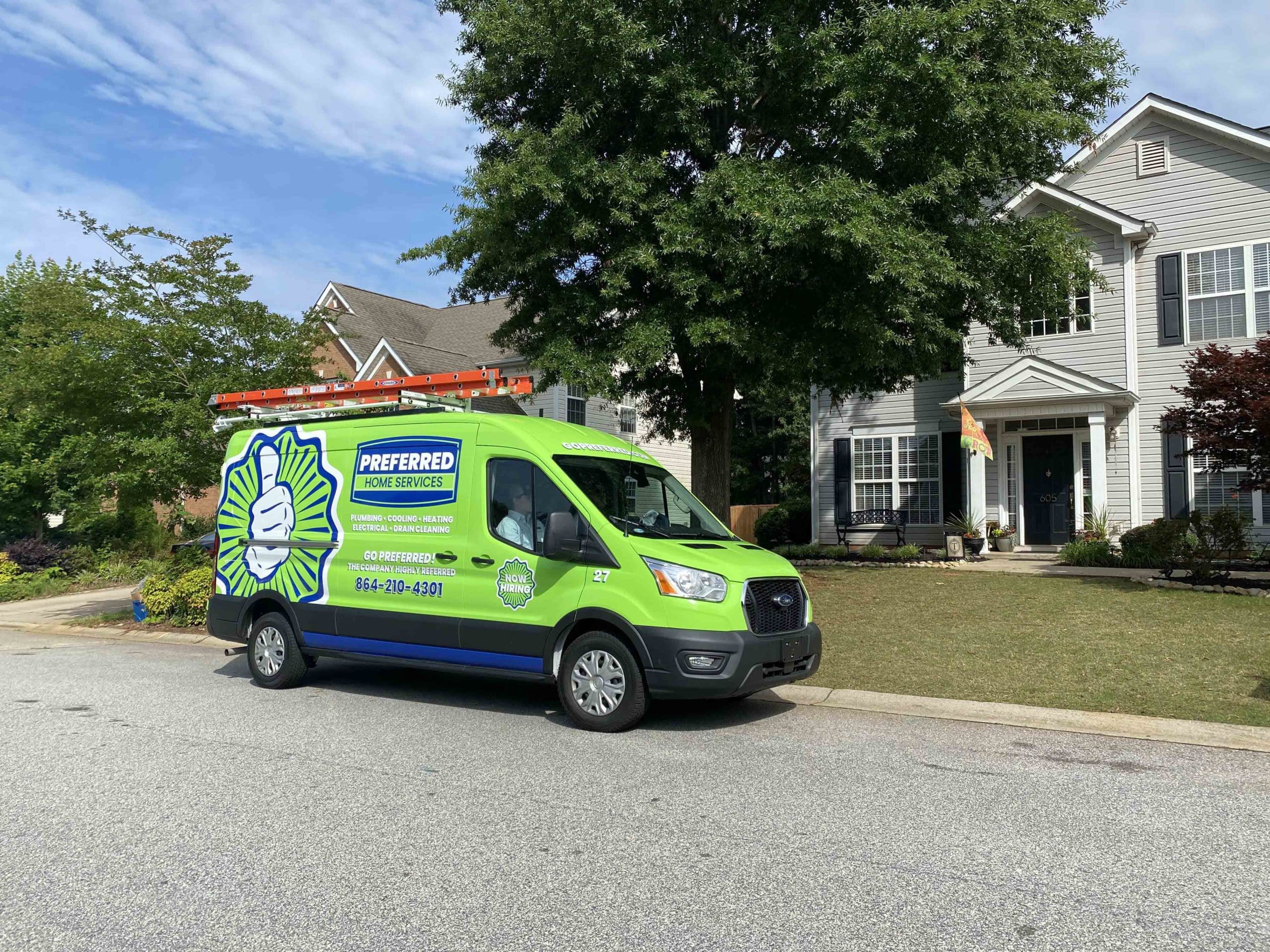 A Preferred Home Services master plumber arrives at a South Carolina home to perform a professional sewer camera inspection, monitoring a digital screen to locate a pipe blockage.