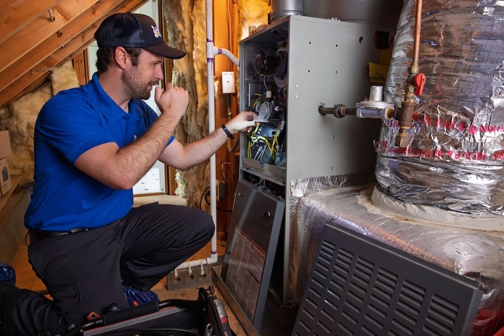 A professional Preferred Home Services technician performs a final calibration on a newly installed unit to provide expert heating system installation in South Carolina.